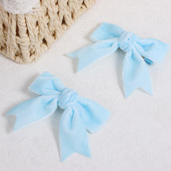 KCHIES light blue velvet ribbon bow close-up showing soft texture and craftsmanship.