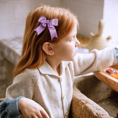 KCHIES purple glitter satin bow clip closeup showing clip teeth for secure hold