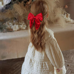 KCHIES red velvet bow closeup shows plush texture and premium finish.