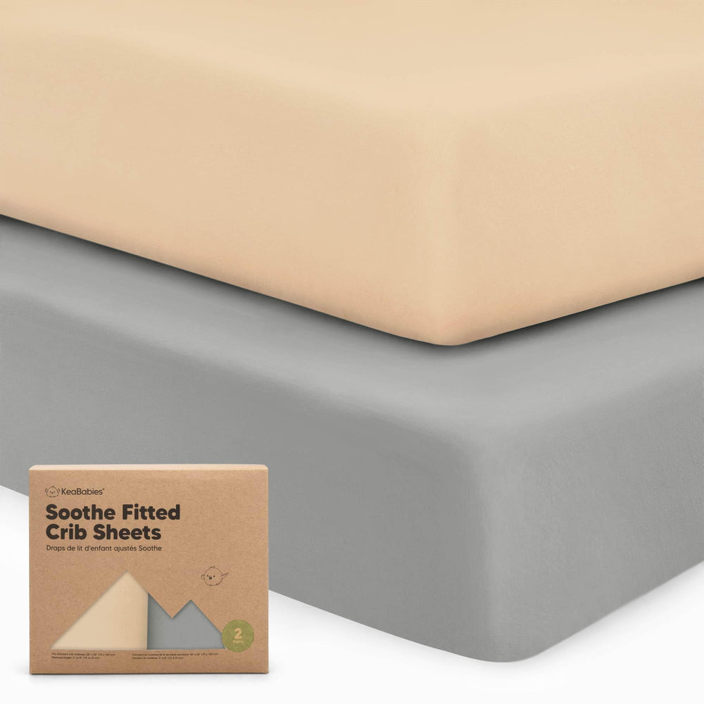 KeaBabies 2-pack crib sheets laid out on a standard crib mattress for safe, soft sleep.