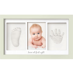 KeaBabies handprint frame closeup with glass cover and wood frame.