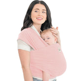 KeaBabies baby wrap carrier in dusty pink worn by mom for hands-free bonding.