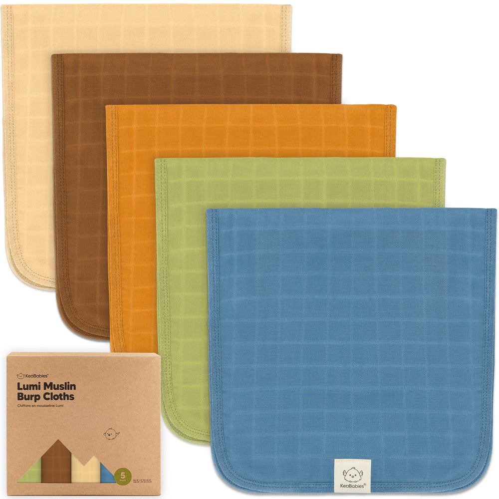 KeaBabies Lumi muslin burp cloth rolled for portable spill protection.