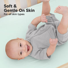KeaBabies SnugFit elastic band keeps crib sheets securely in place.