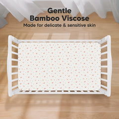 KeaBabies SnugFit crib sheet demonstrating easy fit and removal.