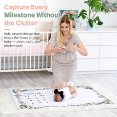 KEMINA BLANKETS monthly milestone prop highlights growth with a soft, floral setting.