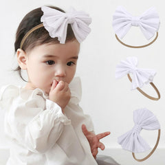 Kenjudess super stretchy headband white bow close-up showing soft nylon comfort for babies