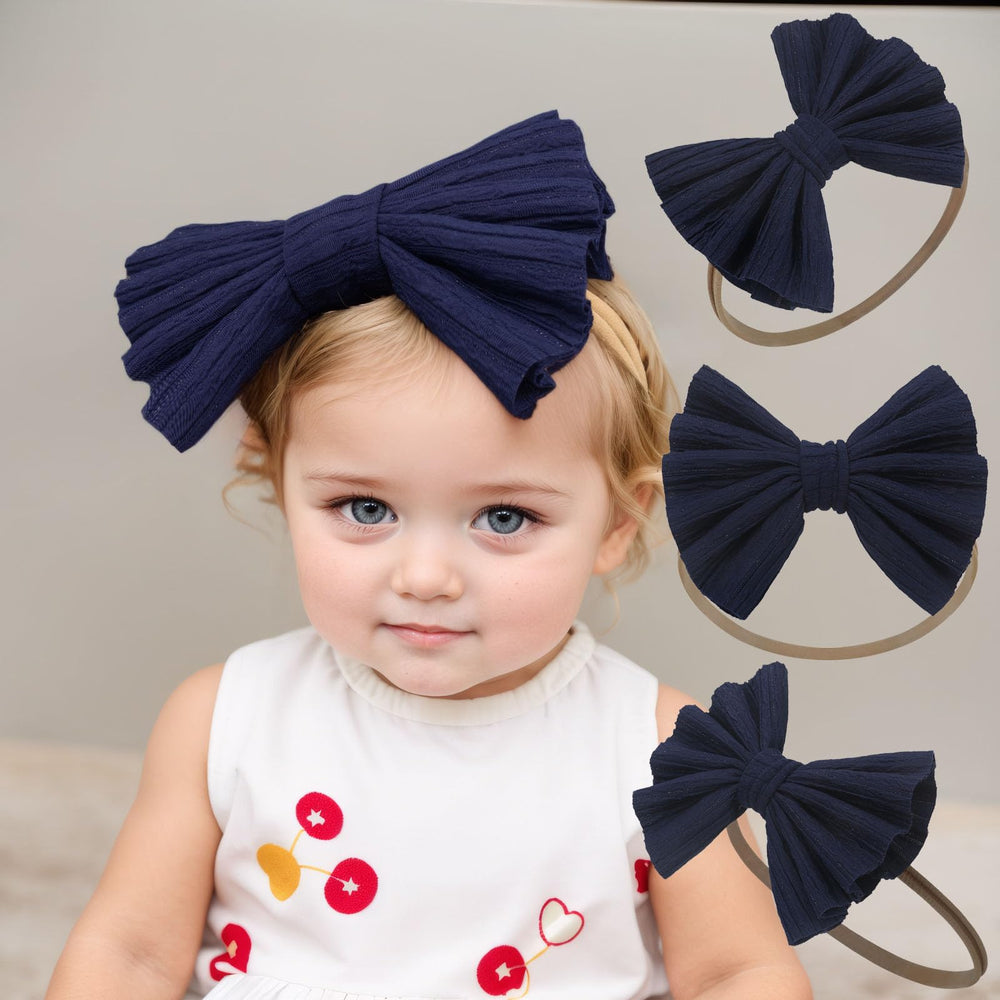 Kenjudess dark-blue bow headband provides secure, comfortable fit for newborns.