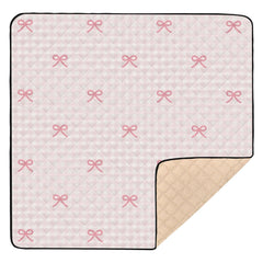 KICPOAY pink checkered play mat folds for travel-friendly floor play.
