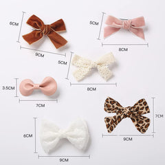 KIDOCHEESE baby hair clip in-use for fine hair keeps hair out of eyes.