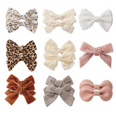 KIDOCHEESE baby hair clip ivory-lined close-up shows gentle non-slip grip.