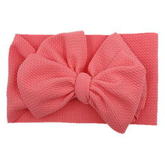 KIDOCHEESE big bows headband closeup bow featuring soft fabric that won’t slip.