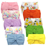 KIDOCHEESE big bows headband in pink color, soft elastic fit for newborns.