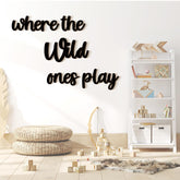 Kigley where-the-wild-ones-play wall sign forms a bold nursery focal point.