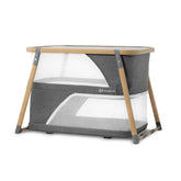 Kinderkraft Sofi travel crib folded in carry bag for easy packing on trips.