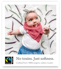 Kishu Baby Indi bib on baby demonstrates stylish drape and outfit protection