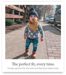 Kishu Baby Indi Terra Set worn as scarf-like bib during meals and cuddles.