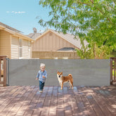 KISKIZ 140-inch retractable gate securing a large doorway for kids and pets.