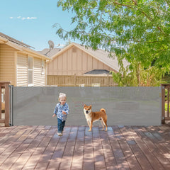 KISKIZ 140-inch retractable gate securing a large doorway for kids and pets.