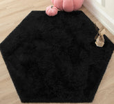 KIXINWA Black Hexagon Rug fluffy closeup highlights plush microfiber softness for cozy play.