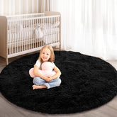 KIXINWA round rug for bedroom 4x4 black provides soft underfoot comfort.