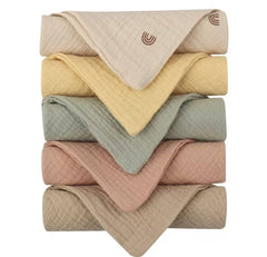 Kjuti Organic Muslin Burp Cloths close-up shows ultra-soft 4-layer weave for absorption.