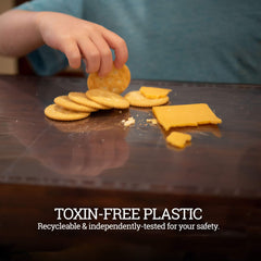 Klean Kids placemats with adhesive strips stay secure during meals.