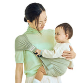 Konny hip seat in green tea with open back support for easy wearing