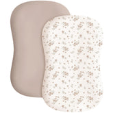 Konssy baby lounger cover Blossom Taupe folded shows soft fabric for baby comfort.
