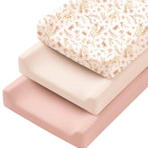 Konssy pink spring changing pad cover closeup shows silky-soft fabric for gentle changes