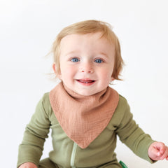 Konssy muslin bandana bib drool detail highlighting gentle touch on skin.