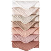 Konssy muslin burp cloths seven-pack flatlay for quick changes and coordinated nursery outfits
