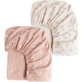 Konssy muslin crib sheet in pink sun offers breathable comfort for baby naps.