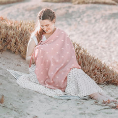 Konssy nursing cover doubles as car seat canopy on the go