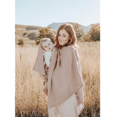 Konssy Muslin Nursing Cover used as car seat cover to shield baby during outings.