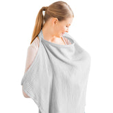 Konssy Muslin nursing cover in grey worn for discreet feeding on the go.