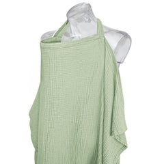 Konssy sage nursing cover used as car seat canopy for privacy.