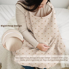 Konssy muslin nursing cover serving as a stroller cover outdoors.