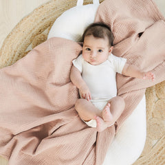 Konssy Muslin Swaddle Blanket 47x47 demonstrates generous size for secure wrapping.