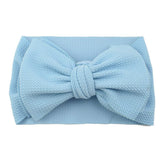 Koolgil baby girl headband blue front view, soft nylon for comfortable photos.