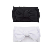 Koolgil baby Halloween bow headband flatlay showing soft fabric and bow