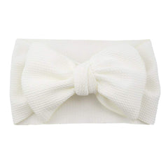 Koolgil Baby Headband Ivory Bow on child for photography sessions.