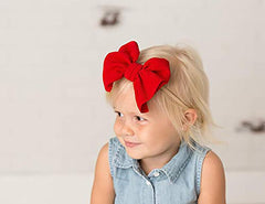 Close-up of the red double bow on Koolgil headband highlighting fabric quality.