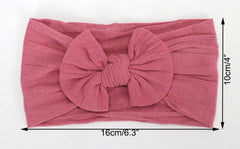 Koolgil soft nylon headband on toddler, elastic fit for growing heads.