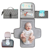 Kopi Baby portable diaper changing pad folded for travel, ideal for quick on-the-go diaper changes.
