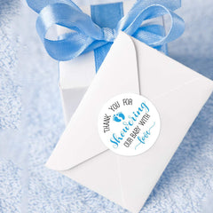 KORTTITALO envelope seals using blue feet stickers for invitations.
