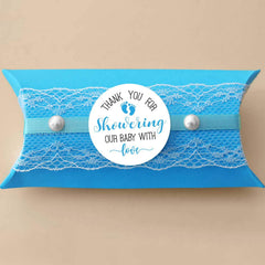 KORTTITALO thank you label for baby shower favors with blue feet motif.