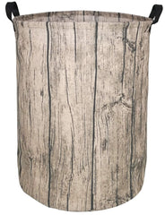 KUNRO round laundry basket tree stump front view, ideal for tidy bedroom laundry storage.