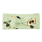 KYTE BABY bamboo bow avocado front view shows gentle stretch for comfy fit.