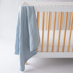 KYTE BABY Fog blanket in a nursery scene shows versatile warmth for naps.